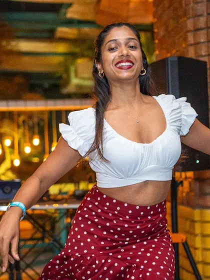 A solo moment during the student performance at La Rumba. Her expression and confidence are a testament to her hard work.