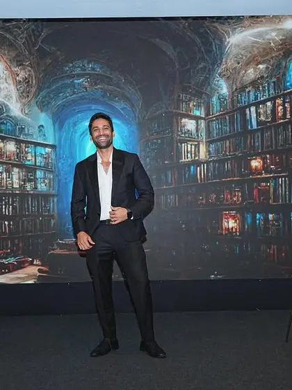A full-stage view of my setup for a corporate mentalism show. The backdrop and lighting are designed to create a magical atmosphere, even in a professional conference setting.