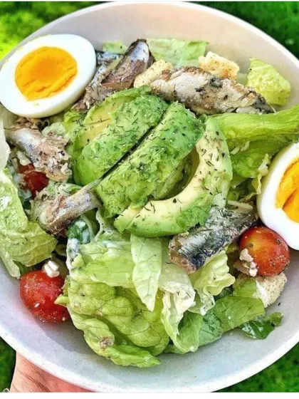 A nutritious and flavorful salad with avocado, hard-boiled eggs, and sardines. We can cater to specific dietary preferences, including keto and paleo.