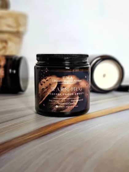 The 'Warm Hug' candle is like a comforting wake-up call in a jar, evoking the cozy ambiance of your favorite coffee shop.