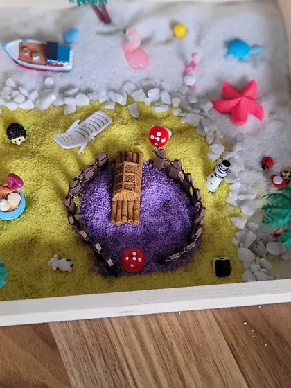 This Zen garden features a small island of purple sand in a sea of yellow. The workshop encourages kids to experiment with colors, textures, and layouts in a calm, supportive environment.