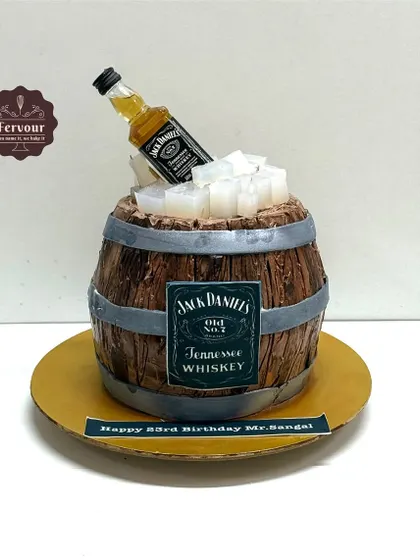 This Jack Daniel's barrel cake is a great example of my 3D sculpted work, perfect for a whiskey enthusiast. I used chocolate and minimal fondant to create the realistic wood grain texture, complete with edible ice cubes and a miniature bottle.