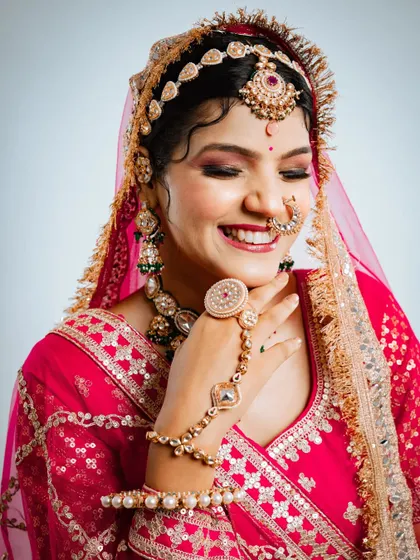 The smile says it all. This close-up captures the happiness of a bride feeling beautiful in her rented outfit.