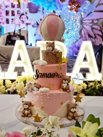 A grand three-tiered teddy bear and hot air balloon cake for a first birthday. I made this on very short notice, and I'm so proud of how beautifully it turned out.