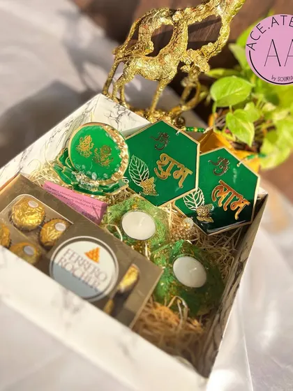 This vibrant green Diwali hamper is perfect for gifting. It comes beautifully packaged with Ferrero Rocher chocolates.