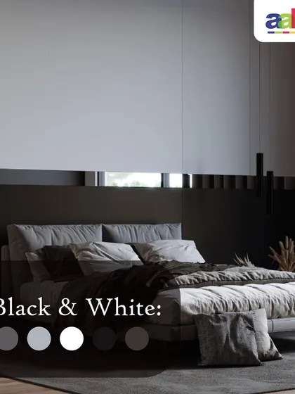 A sleek and modern bedroom design achieved with a timeless black and white palette. The wall features a two-tone finish with a crisp white upper panel and a solid black lower section, creating a bold, graphic look that exudes minimalist elegance.