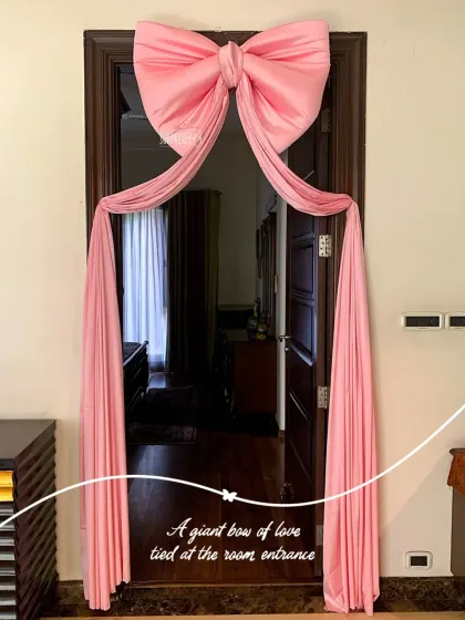 A giant bow of love tied at the room entrance. This simple yet elegant pink fabric bow was a beautiful touch for little Gaurika's homecoming, symbolizing that she is the greatest gift.
