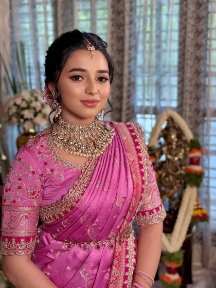The complete look for the bangle ceremony, with the bride looking graceful and radiant in her beautiful pink saree.