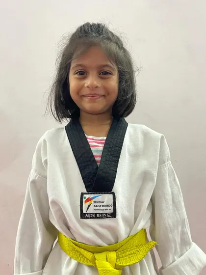 A proud champion from our academy. Her medal is proof that with dedication, anyone can achieve their goals.