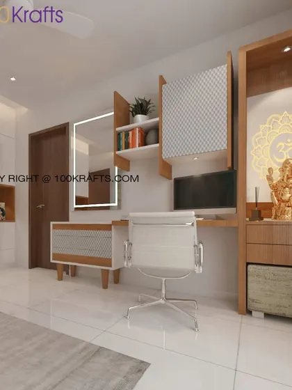 This home office setup is integrated seamlessly into a personal space. It features a dedicated pooja unit next to the desk, blending work and spirituality in a harmonious design.