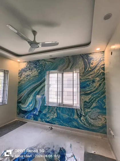 An example of a modern abstract wallpaper installation in a bedroom. The blue and gold marble-like pattern creates a dramatic and sophisticated accent wall, and I ensure the lines flow perfectly around corners.