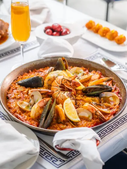 My seafood paella, a dish that tells the story of Spain. Made with saffron-infused rice and the freshest catch, it’s a centerpiece for any celebration, bringing people together around the pan.
