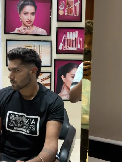A profile view of Harshit Rana's haircut.