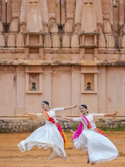 A joyful leap captured in time. This image shows the energetic and celebratory aspect of our duets, a shared moment of exhilaration in movement.