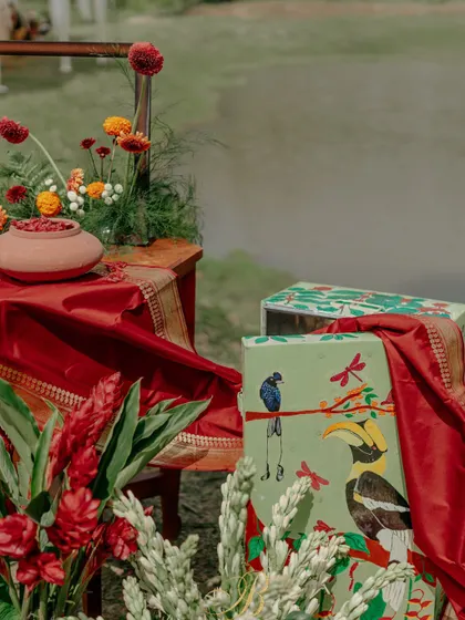 A hand-painted trunk by a local artist, showcasing the flora and fauna of Coorg, serves as a key element in this installation. It's a celebration of local talent and the region's natural beauty.