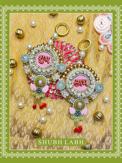 A variation of our Shubh Laabh hangings, this one features a lovely pink center. Each piece is a festive treasure, perfect for bringing good fortune into your home.