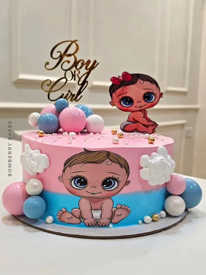Another creative gender reveal cake, using a split pink and blue design and adorable illustrated babies.