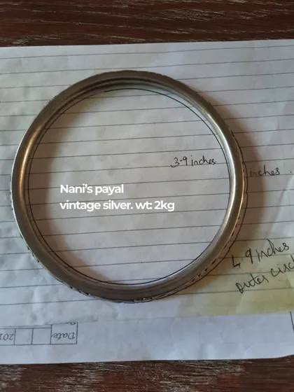 The process begins with a piece of history. Here, we are documenting a vintage silver 'payal' from a client's grandmother, weighing 2kg, to be repurposed into a new piece of jewellery.