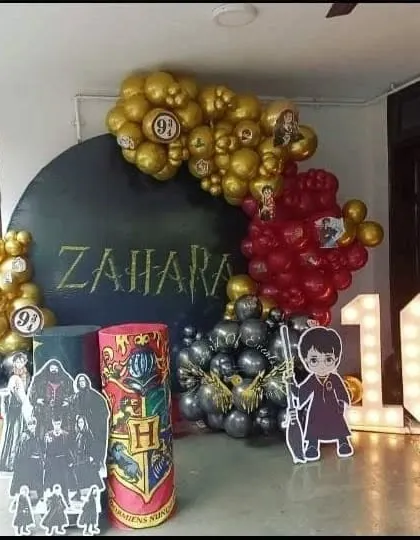 A closer look at the Harry Potter themed birthday party. You can see the details like the marquee number '10', the custom 'ZAHARA' name in Harry Potter font, and the character props that make the theme complete.