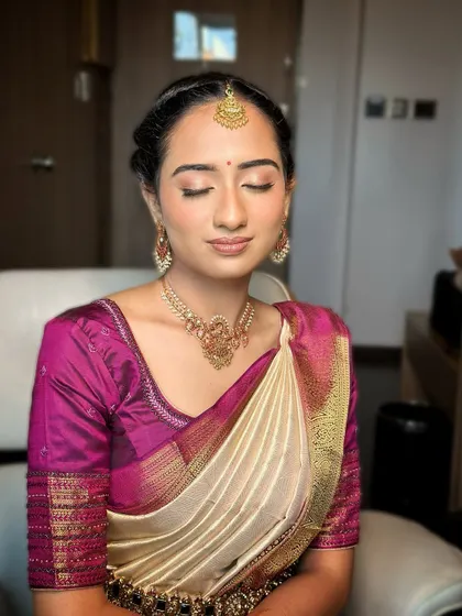 Serenity and radiance defined. This look features a soft, neutral eyeshadow, fluttery lashes, and a skin-like finish, embodying a timeless elegance that enhances her natural beauty.