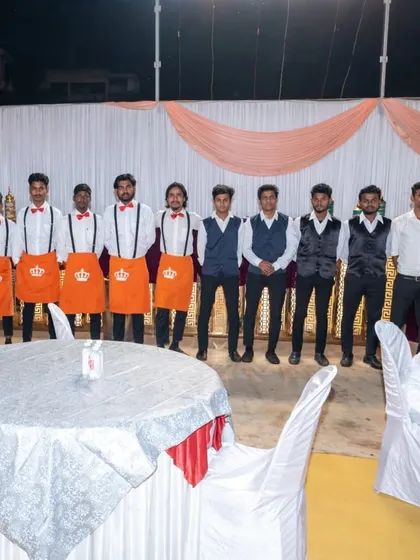 My team is my strength. Here is a part of my professional, uniformed staff ready for service at a large wedding, ensuring everything runs smoothly for you and your guests.