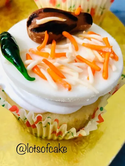 My most creative cupcake, the biryani cupcake! It's topped with fondant that looks like a piece of chicken, rice, and a green chili.