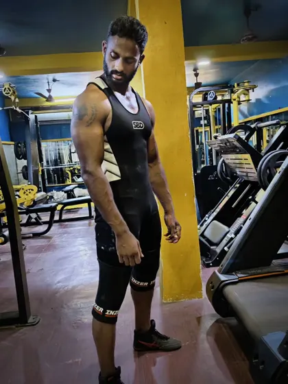 Strength, belief, determination. This pose captures the mindset of a powerlifter ready to step onto the platform.
