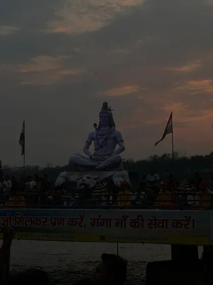 A statue of Lord Shiva at sunset in Rishikesh. The spiritual energy of this town is palpable and provides a constant source of inspiration and connection to the divine.