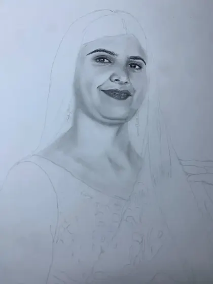 A work-in-progress shot where the face is partially shaded, showing the contrast between the initial outline and the finished sections.