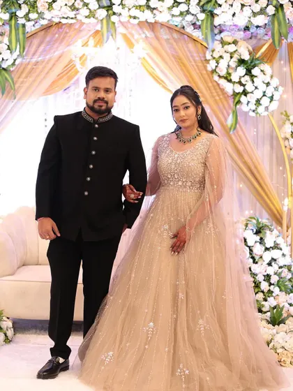 A classic portrait of the newly engaged couple. Her makeup is glamorous yet soft, with defined eyes and a neutral lip that enhances her natural beauty.