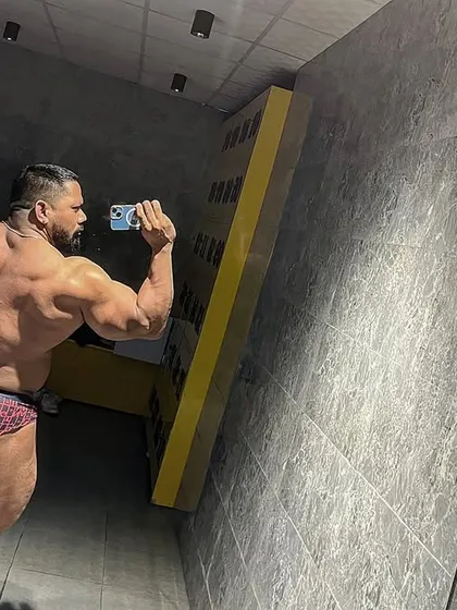 A back lat spread pose, showing the width of the back.