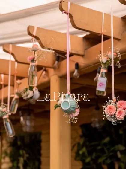 Another shot of the charming hanging teacup floral arrangements, adding a unique and creative touch to the ceiling decor.