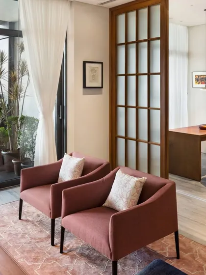 In the Limestone Residence, we used sliding pocket doors to create flexible spaces. Here, the doors open from a cozy den into the main living area, allowing for both privacy and an open-plan feel.