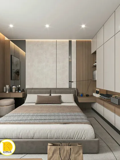 A bedroom with a highly functional design, featuring a bed with an extended headboard that incorporates a nightstand and a dressing table.