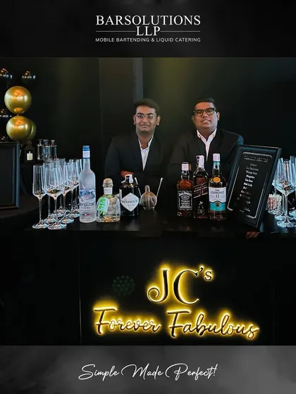 Our bartenders at a sleek, modern bar setup for a private birthday celebration, complete with custom neon signage.