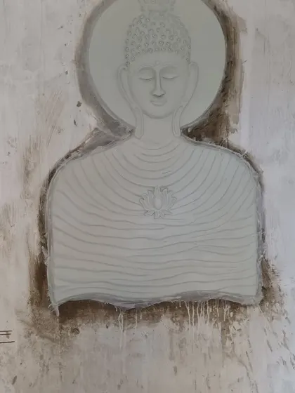 A clean, minimalist Buddha bust sculpted in cement. This style is great for modern interior spaces that need a touch of spiritual calm.