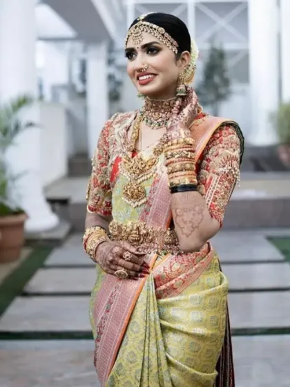 The smile of a happy bride. This photo captures her joy and the elegance of her complete bridal look, from her makeup to her stunning jewellery.