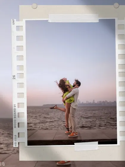 A joyful, candid moment during a pre-wedding shoot at Marine Drive. The iconic Queen's Necklace provides a stunning backdrop for this couple's love story.