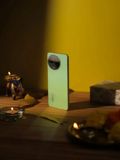 The Narzo phone captured in a dramatic play of light and shadow, with a single spotlight highlighting its design.