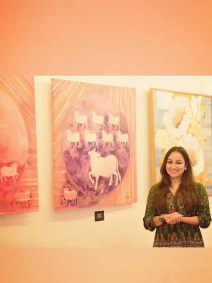Standing with my "Kamaduha" series at a gallery opening. It's always a joy to talk to people about the inspiration behind the work and the blend of traditional and contemporary styles.