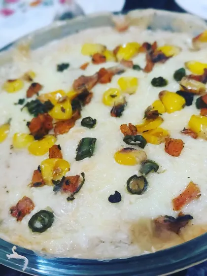 A delicious baked vegetable lasagna, with layers of pasta, creamy white sauce, and colorful veggies, topped with melted cheese.