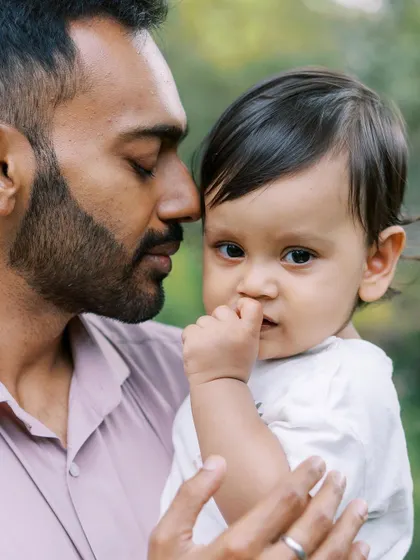 A close-up of a father and son. The intimacy and detail in this shot are what make it so powerful.