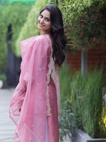 A happy, smiling shot that showcases the client's beautiful smile and the fresh, dewy makeup look.