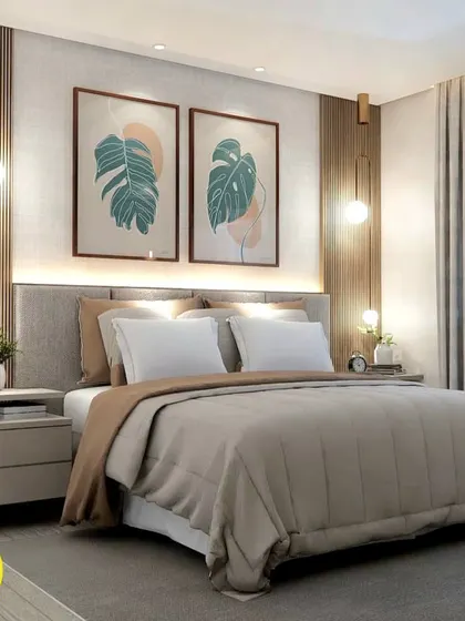 A beautiful bedroom design featuring a custom headboard with botanical art prints and stylish pendant lights. The wood-panelled accent wall adds warmth and texture to the space.