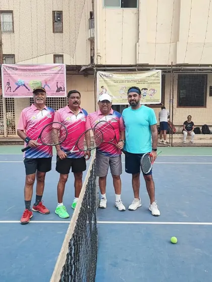 A pre-match photo of a Men's Doubles team at the net, ready for action.