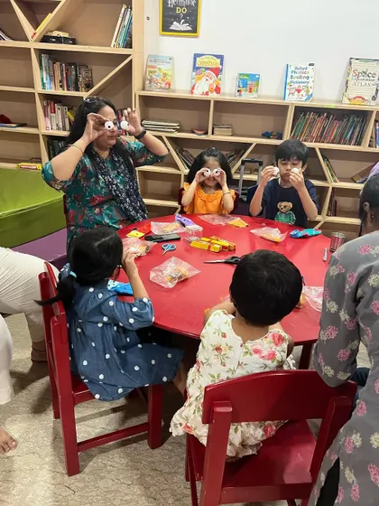 A playful moment during our puppet-making session. We use simple materials to create expressive characters, and there's always room for silliness.