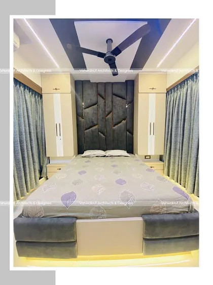 A full view of the master bedroom in Majestic Villa. The bed with under-lighting, the tall headboard, and the matching side cabinets all contribute to a cohesive and high-end design.
