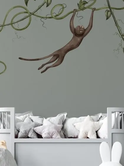 A minimalist and charming wallpaper featuring monkeys swinging on vines, perfect for a modern and playful nursery.