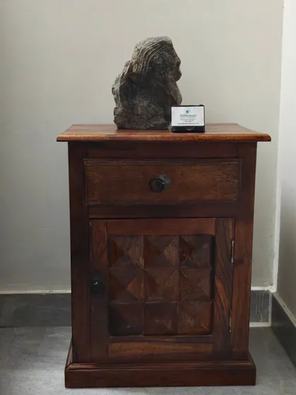 "The Timeless Beauty" abstract sculpture displayed on a wooden side table. Its compact size and intriguing form make it an exclusive decor piece for hotels or living rooms.