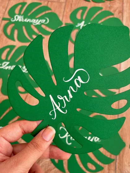 I absolutely loved creating these unique monstera leaf name tags for birthday party favors. The leaves were laser-cut from green cardstock, and I added each name in modern white calligraphy.